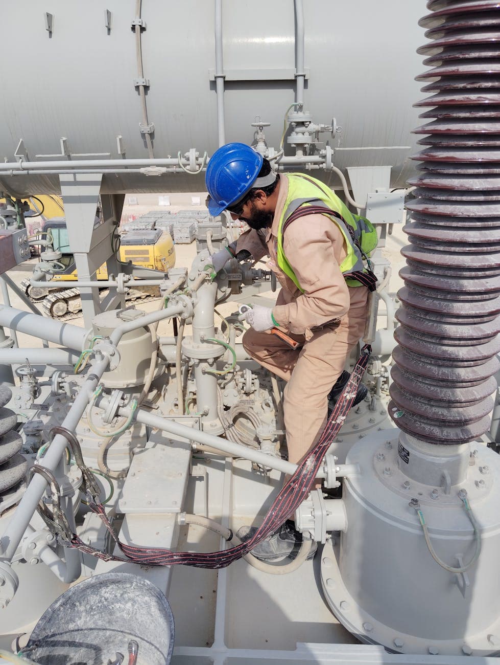 HVAC technician working on installed equipment in the field